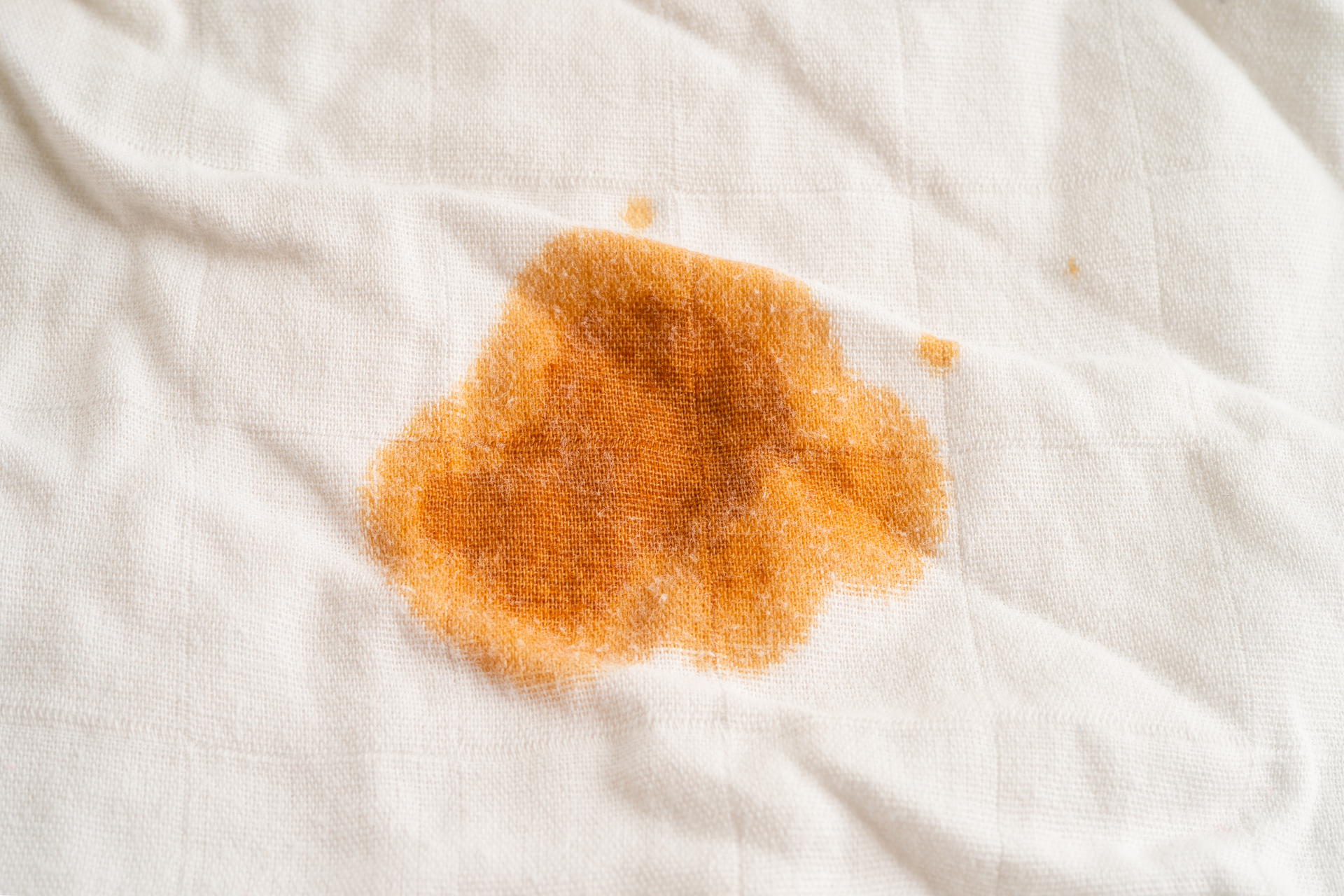 Dirty sauce stain on cloth to wash with washing powder, cleaning